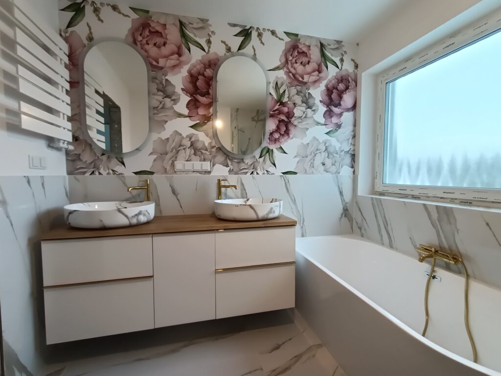 modern bathroom with white bath and flower pattern on the wall and golden elements and two sinks and two mirrors