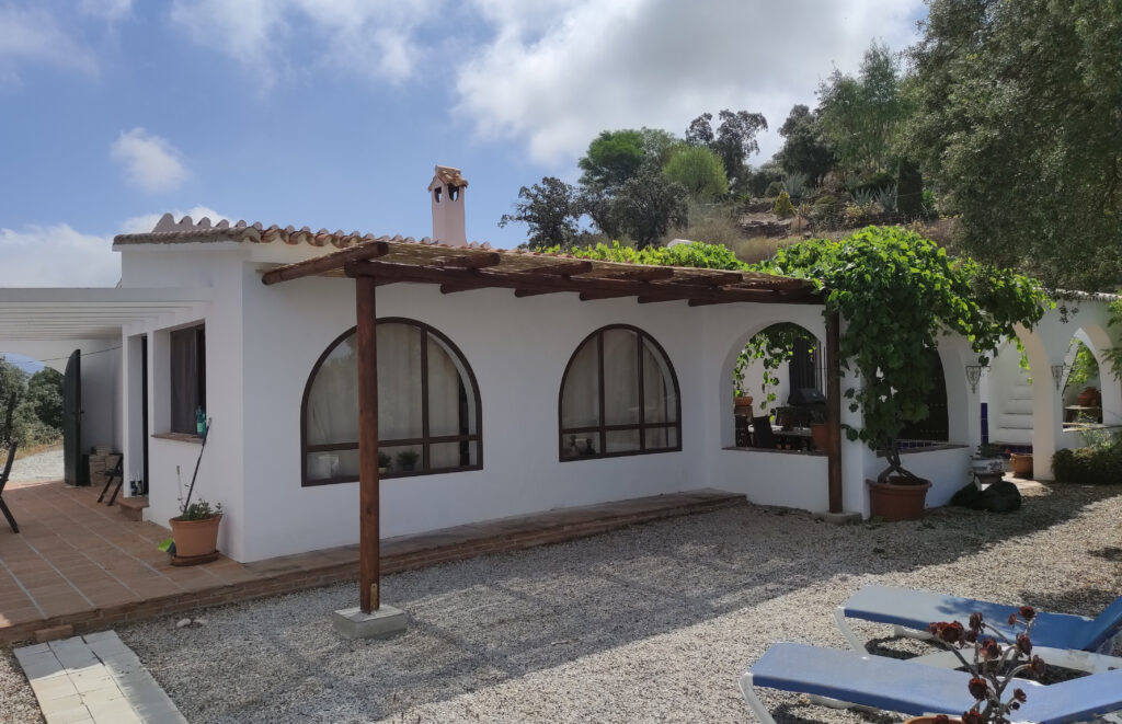 Andalusian country house on the mountains with pergola and plants
